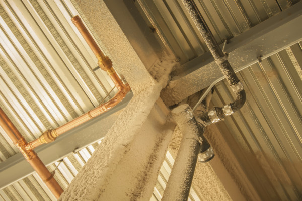 exposed underside of steel floor or roof deck with utilities and